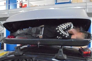 Three Vietnamese nationals were found crammed into a luggage compartment on the top of a car roof as they tried to enter the United Kingdom. Photo UK Home Office