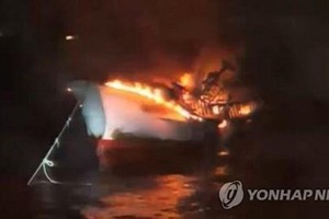Korean fishing vessel suddenly blazes up in water about 74 kilometers southeast of Udo Island, Seogwipo city, Jeju. (Photo:  Yonhap)