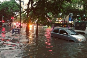 Tropical cyclone spreading from China to Northern Vietnam triggers downpours 