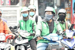 HCMC needs more measures against Covid-19 for app-based motorbike drivers
