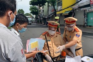 Traffic police handle over 1,000 violators on citywide social distancing order 