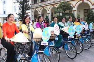 Residents join cycling parade responding to Action Month for Women