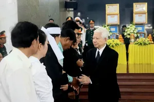 Leaders arrive at funeral hall to pay respects to 12 martyrs