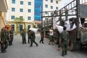 2,000 tons of rice urgently delivered to storm-and-flood-hit people 