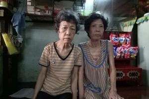 江美（左）與妹妹江秀都患病。