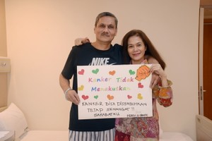 HERRY SURYADI SIRATH與妻子。（圖源：聖丹福廣州現代腫瘤醫院）
