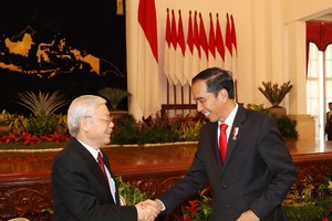 阮富仲總書記會見印尼總統佐科‧維多多。（圖源：越通社）