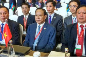 我國公安部副部長黎貴王(前排中)出席Interpol第 86 屆全體大會。（圖源：VOV）