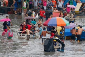颱風“啟德”侵襲菲致 80 人死或失蹤。（圖源：AP）