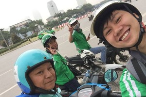 優步與Grab司機合照。（示意：互聯網）