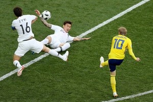 瑞典(黃衣)對韓國比賽一瞥。