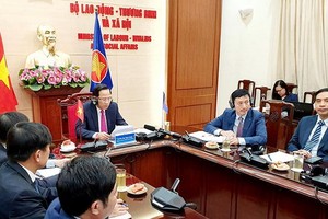 勞動與榮軍社會部長陶玉容（中）在會議上發言。（圖源：越通社）