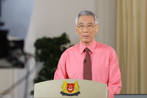 新加坡總理李顯龍發表全國電視演說，建議總統哈莉瑪解散國會提前大選。（圖源：歐新社）