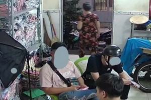 到阮國成家購物的兩個人。