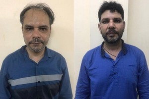 被抓獲的2名外籍劫匪。（圖源：警方提供）