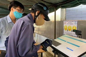 人們到阮智方醫院求診時都需先辦理電子健康申報手續。（圖源：元媚）