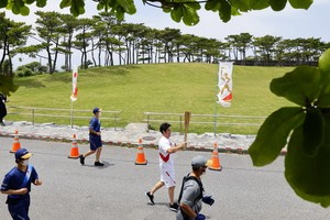 日本福岡縣宣佈，原定在縣內舉行的東京奧運聖火傳遞活動僅進行點火儀式。（圖源：AP）