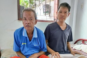 頭部受傷的歐家威（右）與患病的哥哥。