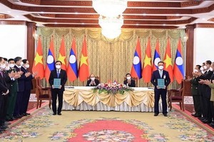 越老電力合作備忘錄簽署儀式現場。（圖源：越通社）