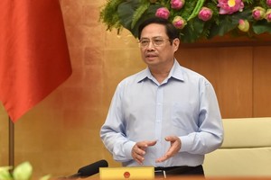 政府總理范明政主持會議。（圖源：VGP）