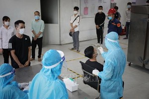 新冠病毒採樣檢測。（圖源：越通社）