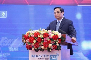 政府總理范明政在會議上發表講話。 （圖：越通社）