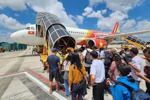 乘客登机。（示意图：互联网）