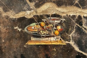 庞贝古城发现圆扁面包壁画