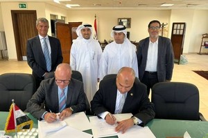 协议签署仪式。（图：The National ）