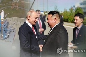 金正恩（右）与普京。（图：韩联社）