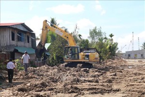 美荻市泰山乡正清拆场地为施工迪庙2桥服务。（图：越通社）