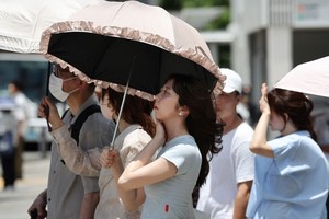 日本近日天气酷热。（图：AFP）