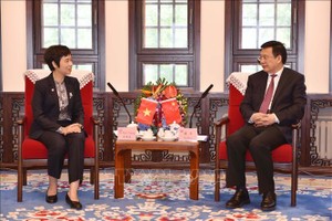 越南通讯社社长武越庄与新华社社长傅华会谈。（图：越通社）