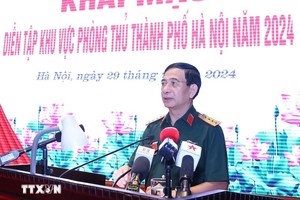 国防部长潘文江大将在开幕式上致词。（图：越通社）