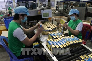 工人在平阳省Nutifood营养食品股份公司上班。（图：越通社）