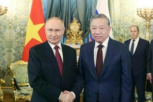 党中央总书记苏林与俄罗斯总统普京。（图：越通社）