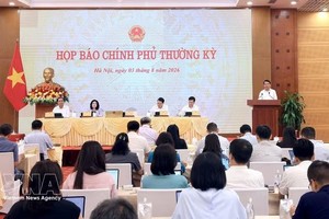 政府例行记者会现场。图自越通社
