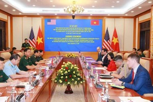 关于克服战后越南化学毒剂/二恶英后果项目的限制范围项目协议签署仪式现场。图自越通社