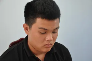 Đối tượng Lý Gia Huy tại cơ quan điều tra.   Ảnh: ĐỨC LÂM