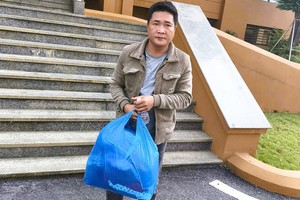 陈明武及近80亿元现金赃物。 图：清化省公安