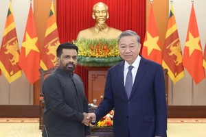越南共产党中央总书记、国家主席苏林与斯里兰卡总统阿努拉·库马拉·迪萨纳亚克。图：越通社