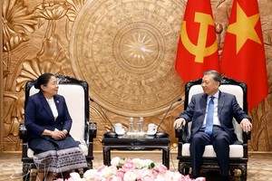 越南共产党中央总书记、国家主席苏林会见老挝人民革命党中央组织部部长西赛。图：越通社