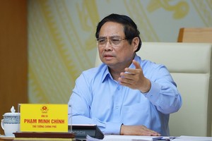 政府总理范明政在会议上致辞。图自越通社 