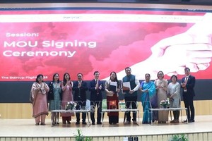 双方签署合作备忘录。图自越通社 