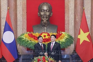 国家主席梁强会见老挝总书记、国家主席通伦·西苏里。 