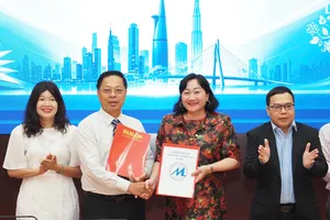 Lễ ký Ký kết hợp tác giữa Báo Sài Gòn Giải Phóng và Trường Đại học Tài chính - Marketing sáng 2-10 - Ảnh: HOÀNG HÙNG