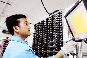 The man working for an US electronic firm in HCMC (Illustrative photo: SGGP)