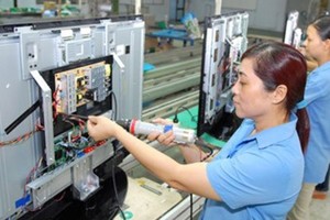 Electronics and information technology is one of four key industries posting high growth rate in the first half of 2017 (Photo: SGGP)
