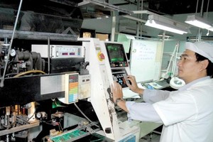 An electronic plant in Tan Binh district, HCMC. Electronic import turnover was one of items with high year on year increase in the first seven months this year (Photo: SGGP)