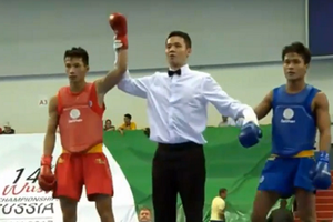 Vietnamese wushu fighter Vo Minh Duc  (in red) (Source: vothuat.vn)